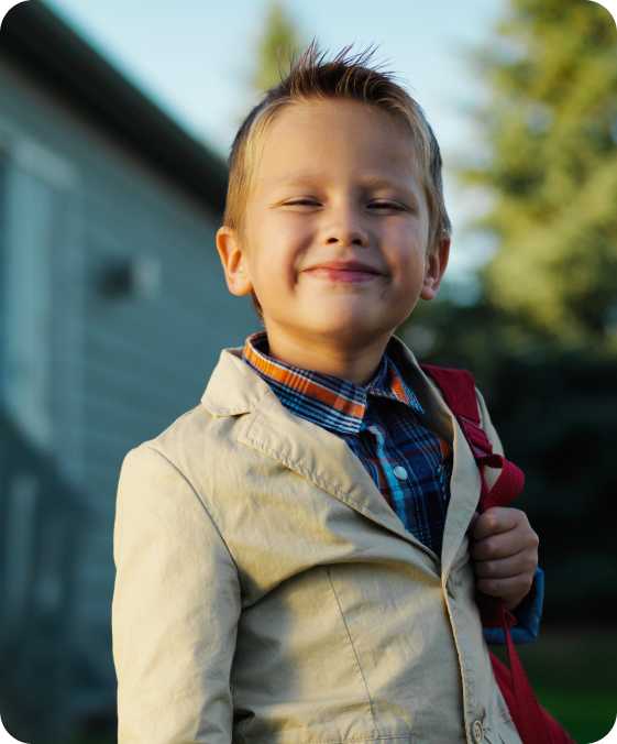 a young man is dressed up with his backpack on