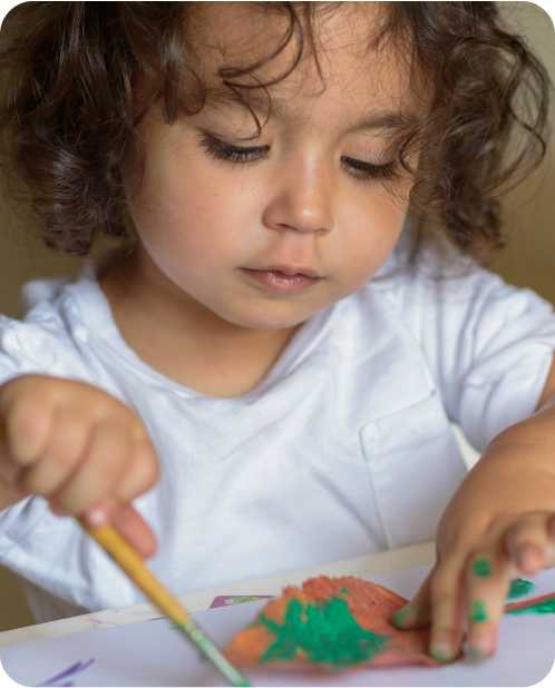 a child plays with paint