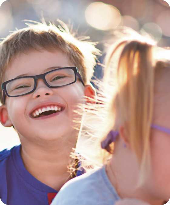 a young boy smiles