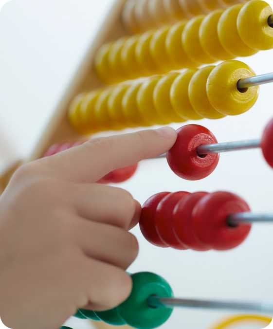 a child moving the dots on an abbacus