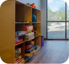 a bookshelf in a room in the Scottsdale Children's Institute